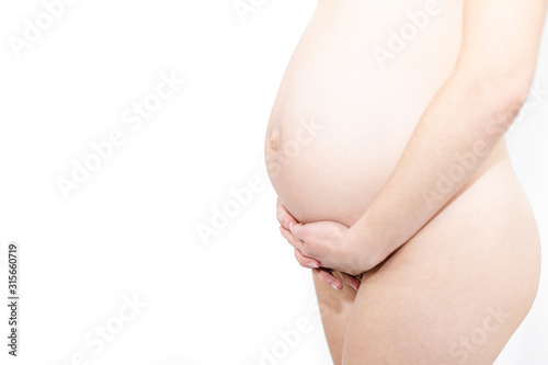 Obraz na płótnie Young pregnant naked woman w salonie