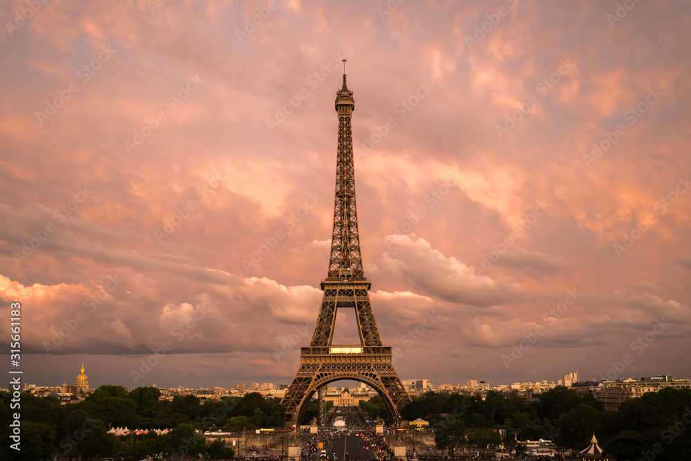 Naklejka premium Beautiful view of famous Eiffel Tower in Paris at sunsey before twilight, France. Paris Best Destinations in Europe.