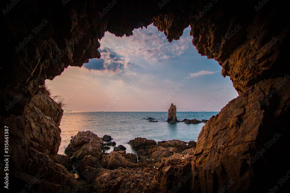 Seaside cave with sunset views Stock Photo | Adobe Stock