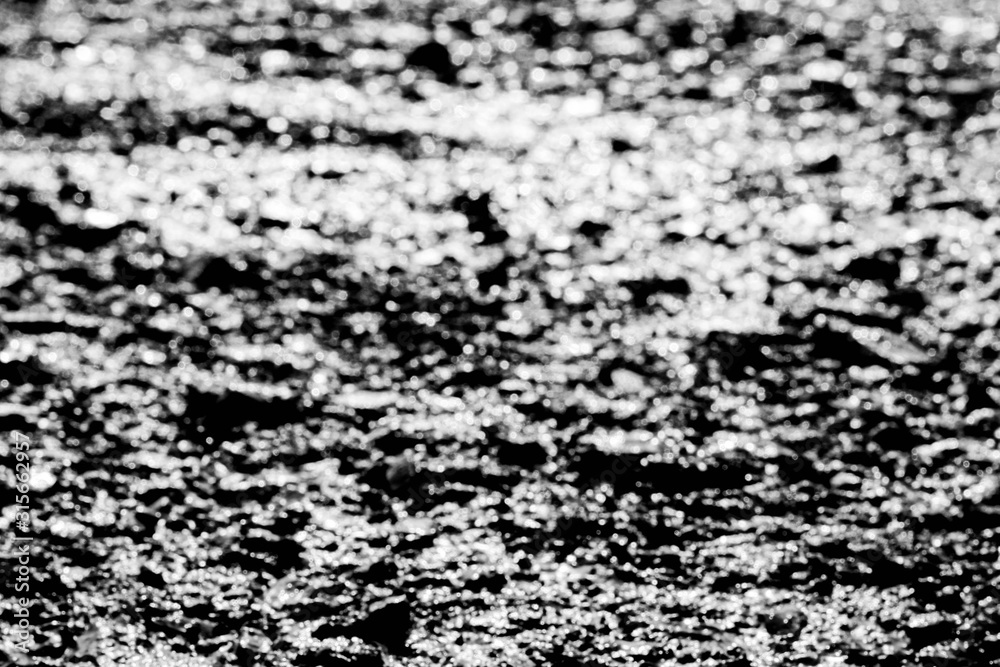 The surface. The asphalt is black.