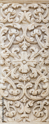 ACIREALE, ITALY - APRIL 11, 2018: The floral relief on the facade of church Basilica Collegiata di San Sebastiano.