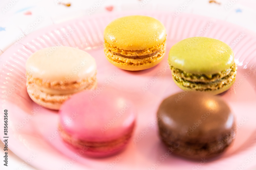 Several French multicolored macarons during a party Several French multicolored macarons during a party