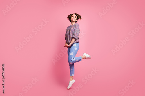 Full length body size view of her she nice attractive lovely pretty modest cheerful cheery glad carefree brown-haired girl jumping having fun isolated over pink pastel color background
