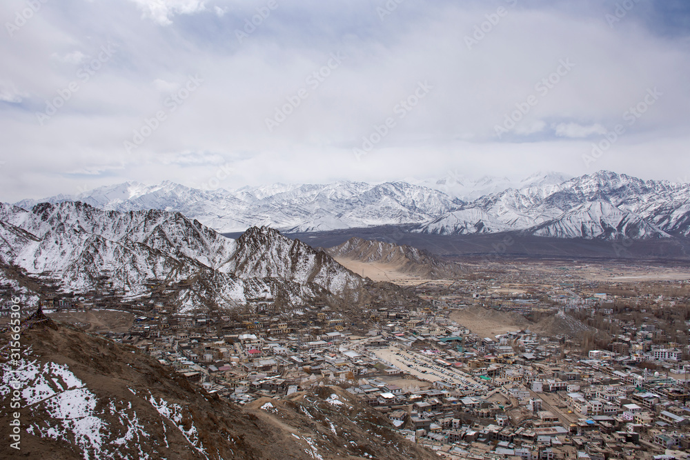 View landscape and cityscape of Leh Ladakh Village with high mountain range from viewpoint Tsemo Maitreya Temple or Namgyal Tsemo Monastery while winter season in Jammu and Kashmir, India