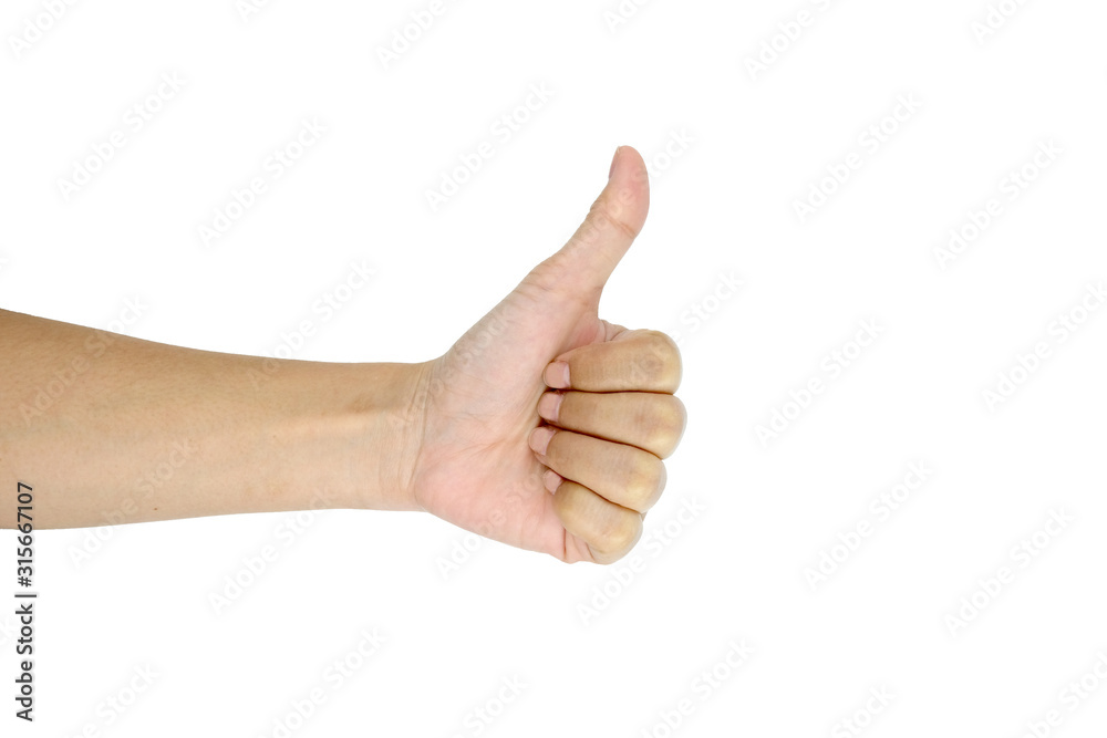 Closeup of female hand showing thumbs up sign against isolated on white background Closeup of female hand showing thumbs up sign against isolated on white background