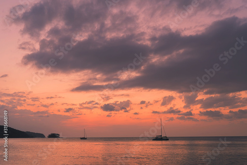 Blue sky with cloud bright background at Phuket Thailand. Twilight time orange tone. © Stock.Foto.Touch