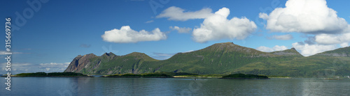 Panoramic mountain view in mountainous summer terrain in northern Norway. Senja Island, Troms County - Norway. Beauty of nature concept background.