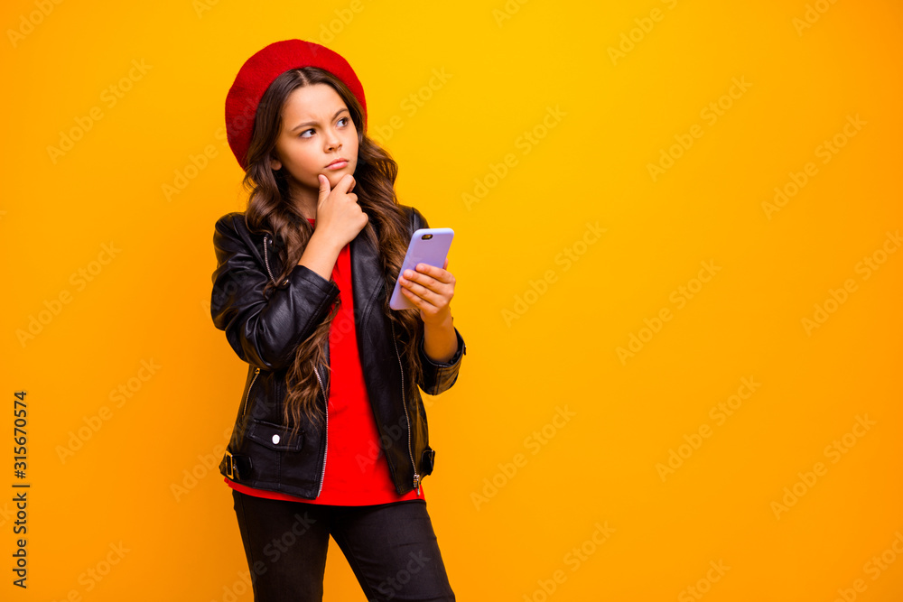 Portrait of her she nice attractive trendy bewildered long-haired girl wearing streetstyle using cell creating new post isolated over bright vivid shine vibrant yellow color background Portrait of her she nice attractive trendy bewildered long-haired girl wearing streetstyle using cell creating new post isolated over bright vivid shine vibrant yellow color background