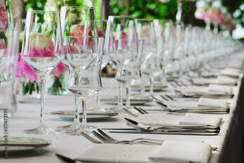 Obraz na plátně row of glasses on the decorated table
