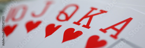 Fotografie Playing cards lying at money stake with royal flush combination