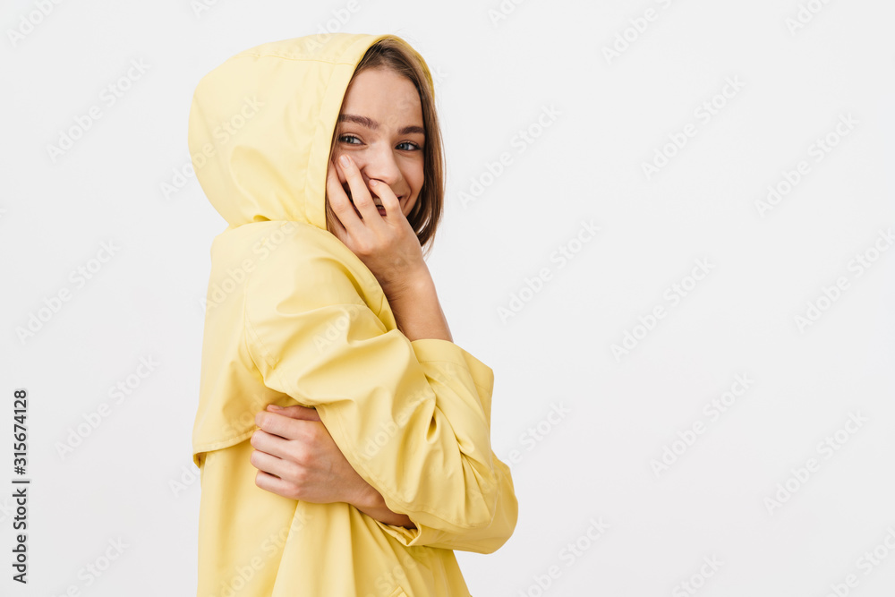 Photo of funny caucasian woman in raincoat posing and laughing isolated over white background Photo of funny caucasian woman in raincoat posing and laughing isolated over white background