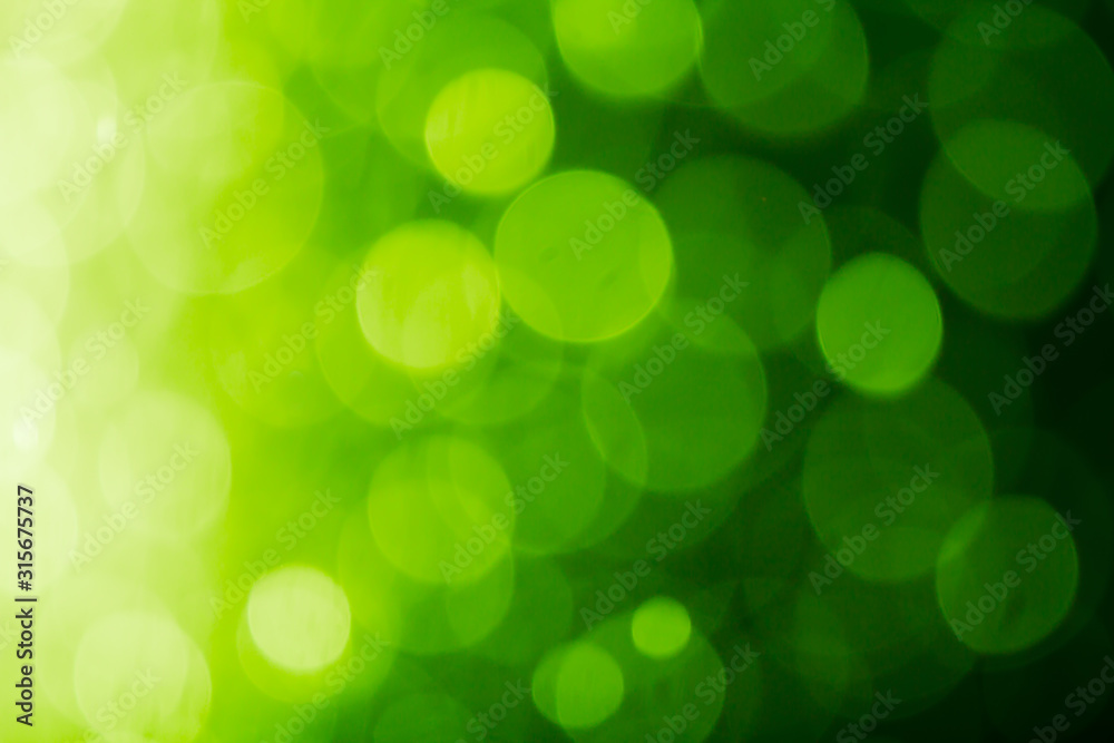 Obraz premium Dark green bokeh abstract of blurry lights background