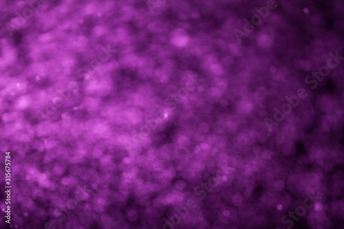 Abstract purple bokeh of blurry lights background