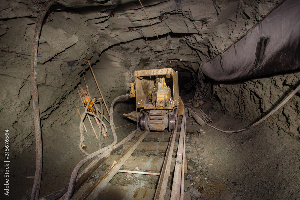 Naklejka premium Underground gold mine shaft tunnel drift with loading machine eimco