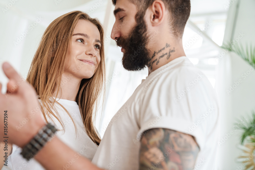 Image of romantic pleased couple hugging and dancing Image of romantic pleased couple hugging and dancing