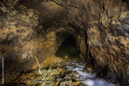Photo Underground gold mine settler pond waterfall
