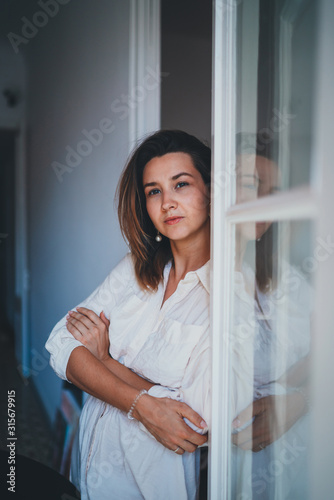 Free Download Vertical Portrait of Young Beautiful Female Creative Artist Working at Vintage Loft Looks Thoughtful or Joyful - GFXLoad