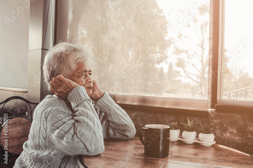 Thoughtful serious anxious mature senior woman feeling worried about problems. Concept dramatic loneliness, dementia, abuse, sadness, depression, sad emotions, cry, disappointed, healthcare, pain.