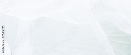 View of white crumpled fabric. Cover natural not perfect white background