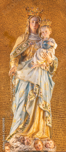 MENAGGIO, ITALY - MAY 8, 2015: The carved polychrome statue of Madonna church chiesa di Santo Stefano by Luigi Tagliaferri (1841-1927).