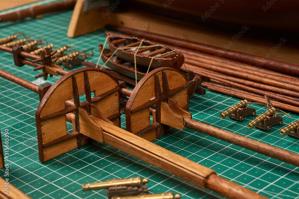 Ship model building in progress. Assembly of ship model from wood Stock