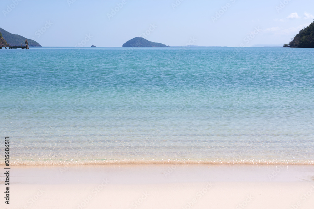 Blue sea waves summer background. Sand beach