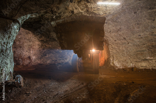Underground gold bauxite mine shaft tunnel with LHD machine scoop