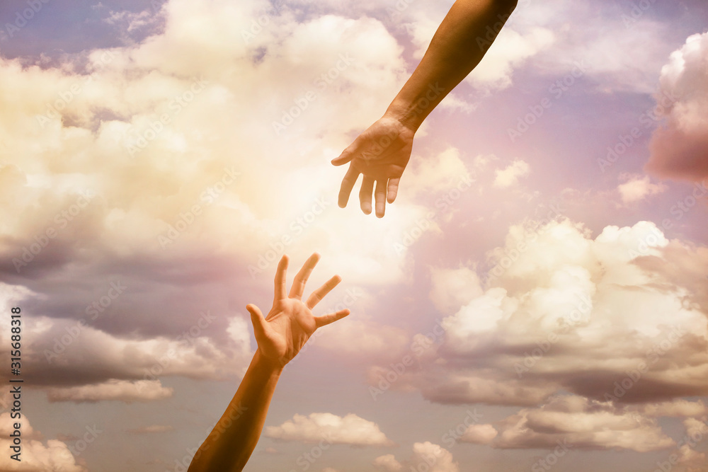 two hand trying to connect together with sky as a background. two hand trying to connect together with sky as a background.