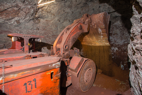 Underground gold bauxite mine shaft tunnel with LHD machine scoop Toro photo