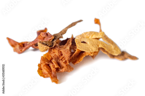 dried smoking tobacco Isolated on a white background. © k_samurkas