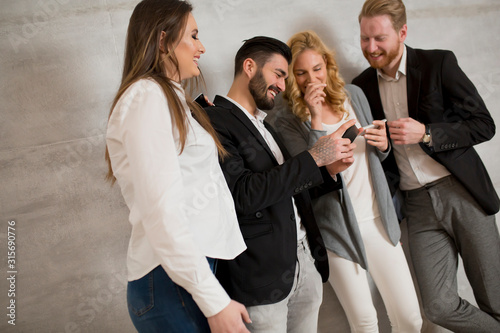 Young people with mobile ph...