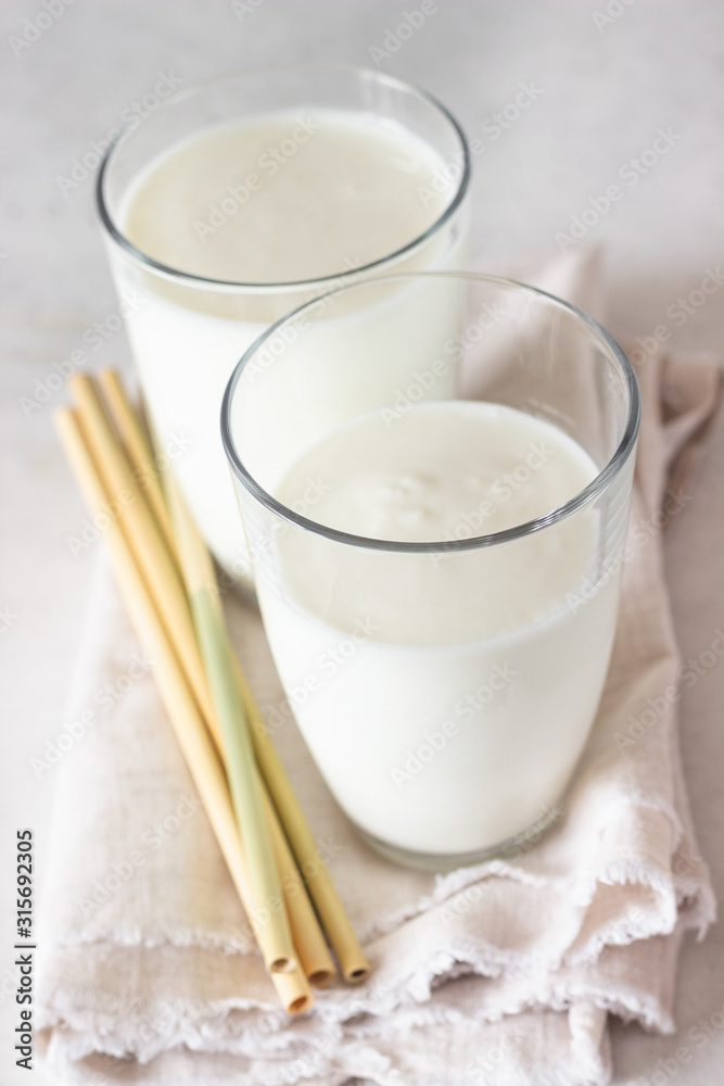 Homemade kefir. Organic probiotic kefir drink or yogurt with probiotics in glasses. Probiotic cold fermented dairy drink. Trendy food and drink. Homemade kefir. Organic probiotic kefir drink or yogurt with probiotics in glasses. Probiotic cold fermented dairy drink. Trendy food and drink.