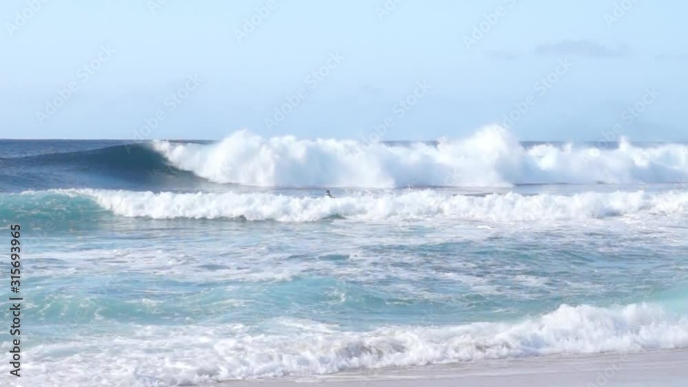 Surfers in the waves of Rock Piles Beach, Oahu, Hawaii, USA Surfers in the waves of Rock Piles Beach, Oahu, Hawaii, USA
