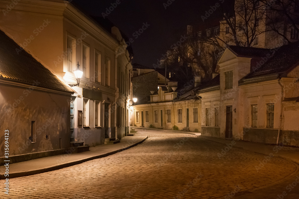Night winter view of the old buildings in the historical part of Tallinn. The city is the capital and the most populous city of Estonia.
