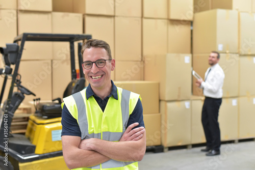 Worker in a warehouse in the logistics sector - transport and processing of orders in trade