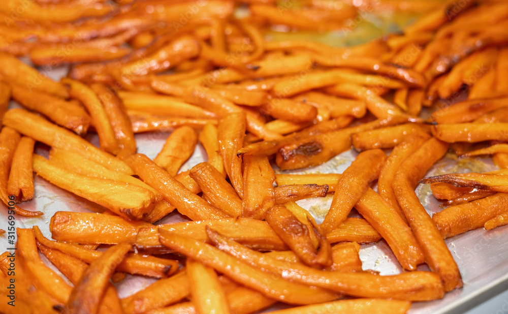 Dried carrots on a metal tray. Beautifully toasted in the oven. Dried carrots on a metal tray. Beautifully toasted in the oven.