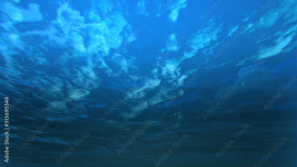 deep blue ocean with underwater angle by 3D rendering scene