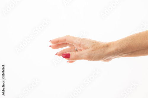 woman hand in a delicate gesture isolated on white