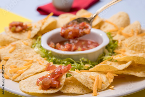 Close up of salsa on chips.