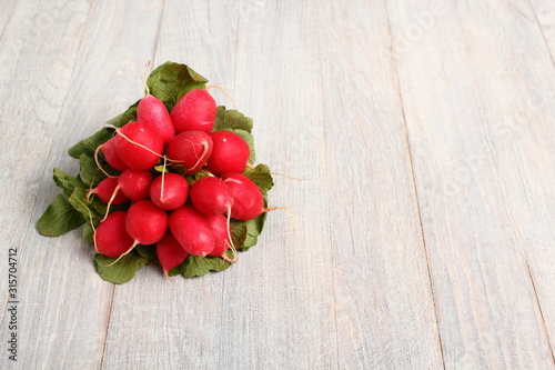 Radish on wooden table with copy space
