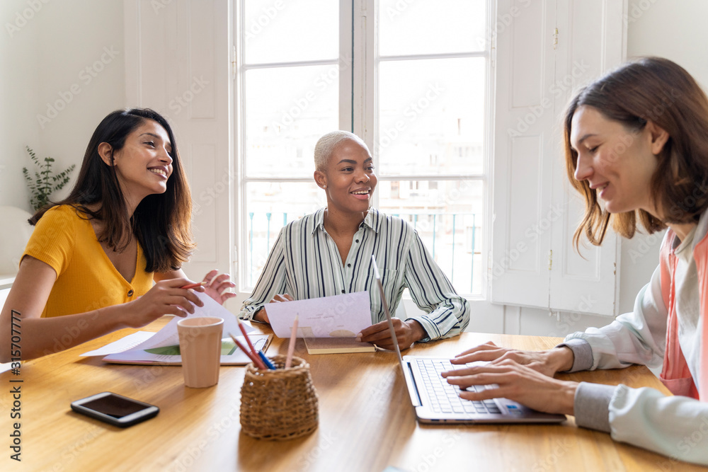 Businesswomen having a meeting in office Businesswomen having a meeting in office