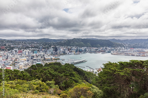 New Zealand, Wellington, Clouds over coastal city seen from summit of Mount Victoria photo