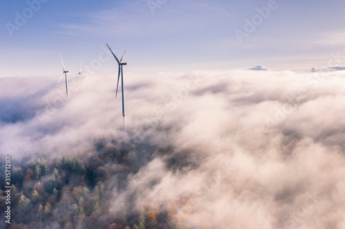 Germany, Baden-Wurttemberg, Goldboden, Wind farm shrouded in autumn fog