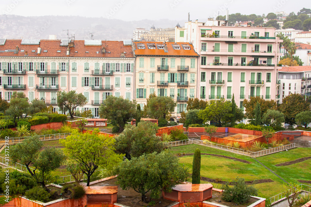 View to Sacha Sosno Garden and Nice in rainy day, France