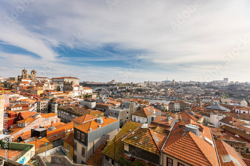 Portugal, Porto District, Porto, Clouds over roofs of city buildings seen from Miradouro da Vitoria photo