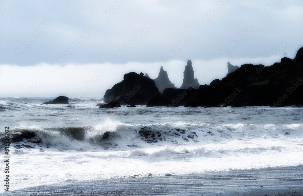 volcanic rock formation of Dyrholaey near Vik in stormy weather southern Iceland volcanic rock formation of Dyrholaey near Vik in stormy weather southern Iceland