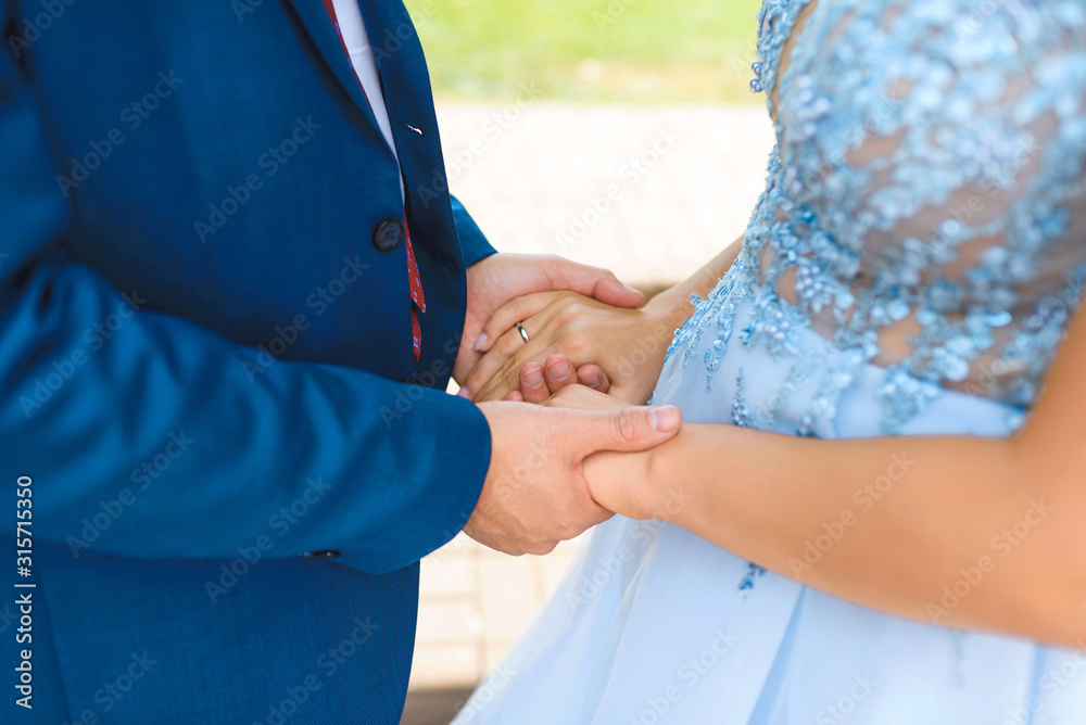 bride and groom holding hands