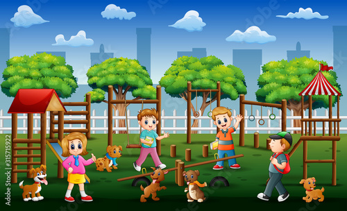 Children and friends playing in a public park with their pets