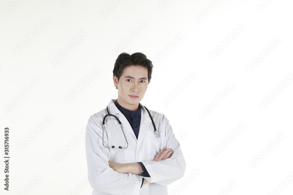the young asian medical doctor and his stethoscope at isolated white background copy space the young asian medical doctor and his stethoscope at isolated white background copy space