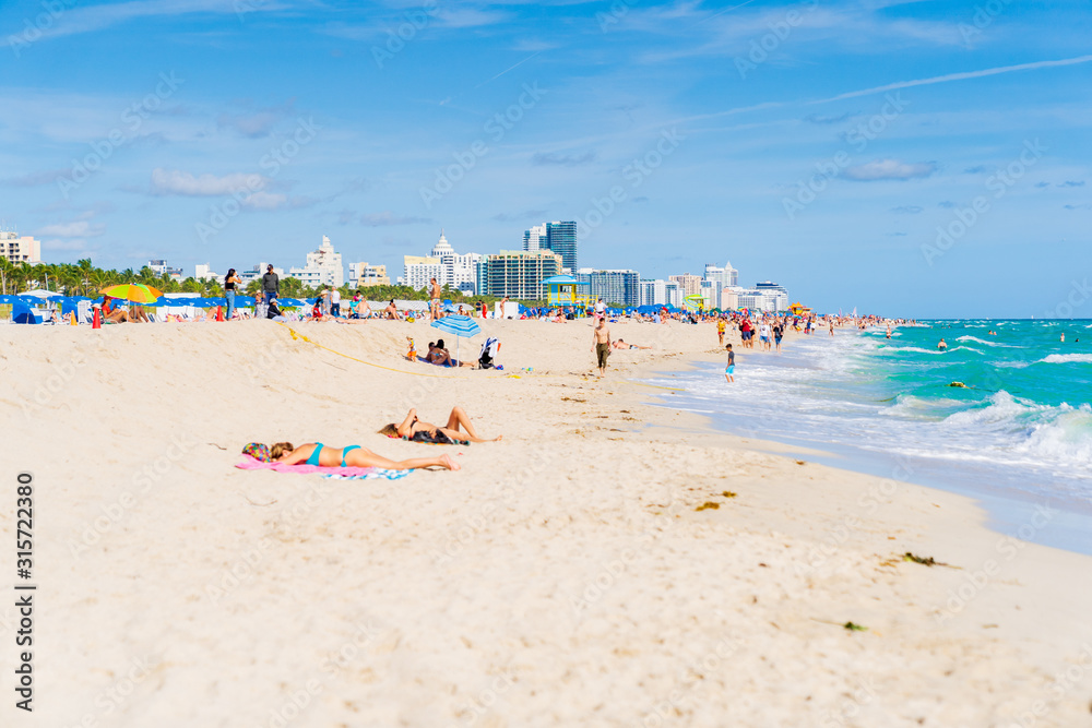 Beachgoers Enjoying The Beautiful Beaches of South Beach, Miami. Beachgoers Enjoying The Beautiful Beaches of South Beach, Miami.